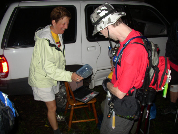 A hiker is scanned as he departs